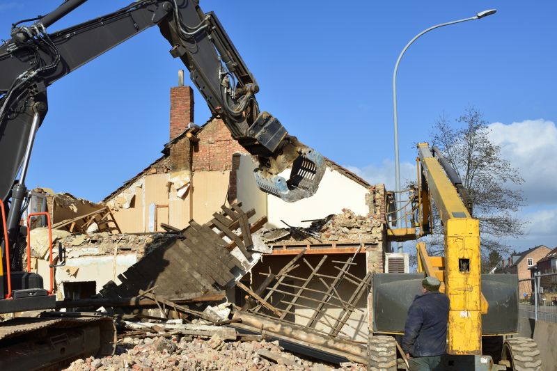 Excavator Demolishing a Building